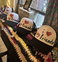a group of hats with the words i love friends on them